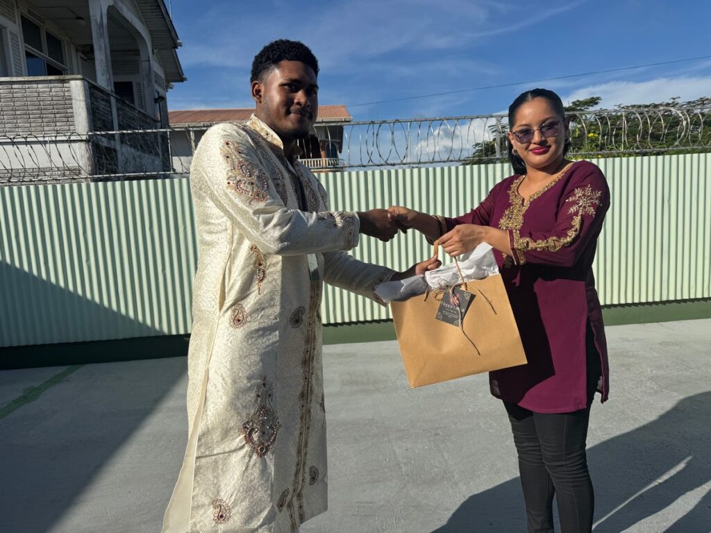 Winner of the Male Best Dressed Competition, Mr. Ronaldo Jacobis, Receiving his Award