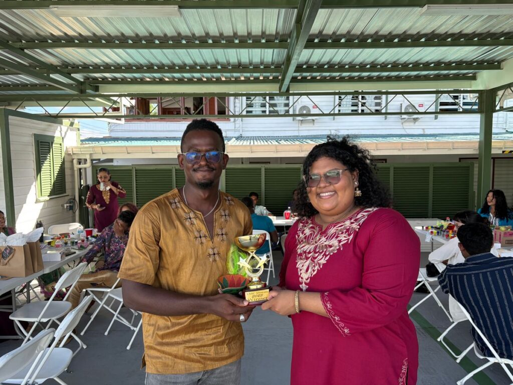 Winner of the 2025 Diya Painting Competition, Mr. Jumel Jarvis, Receiving his Award