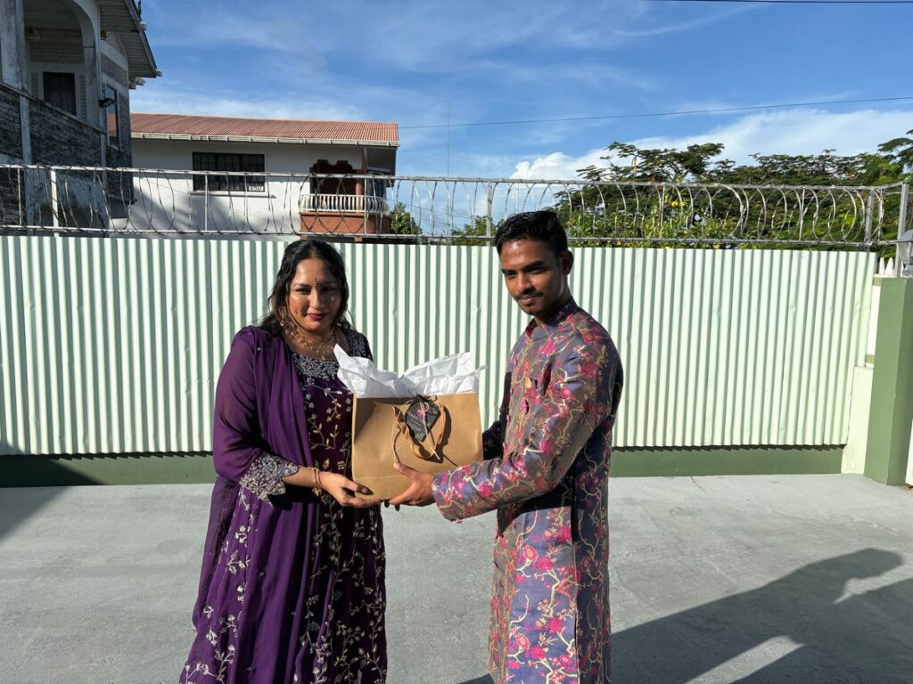 Winner of the Female Best Dressed Competition, Ms. Bhudranie Boodhoo, Receiving her Award