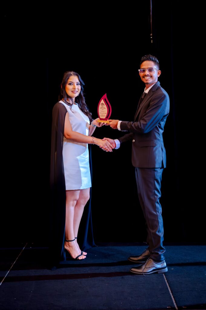 Deopaul Somwaru Receiving the Innovation & Creativity Award