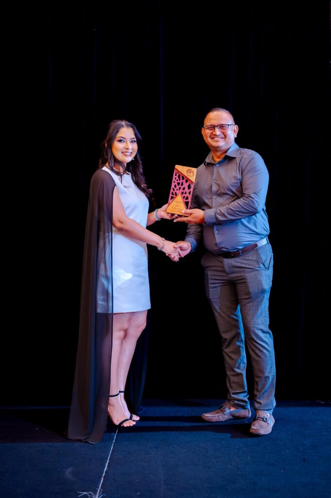 Khalid Alladin receiving the Legacy Award