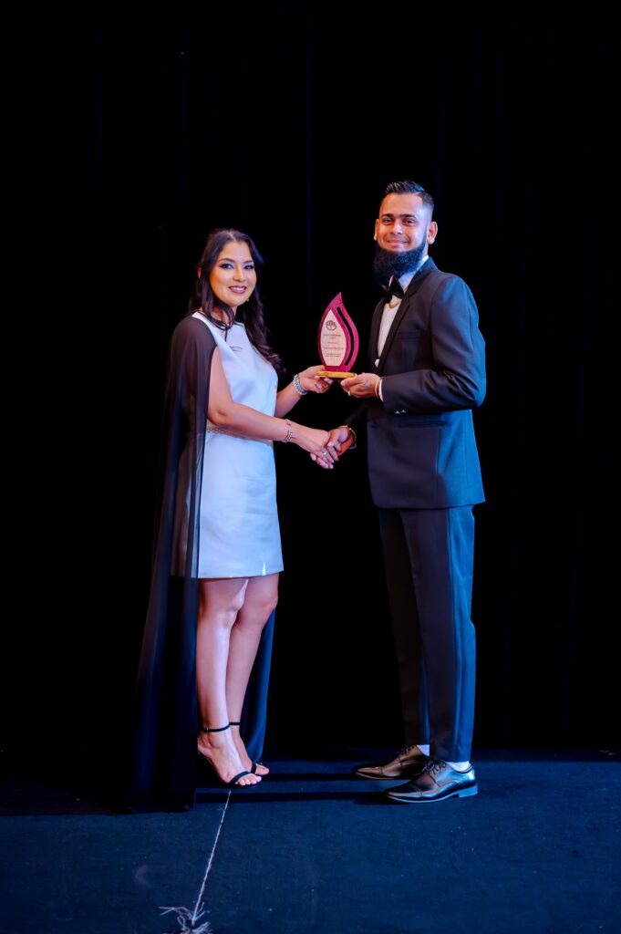 Totaram Mangroo receiving the Team Player Award