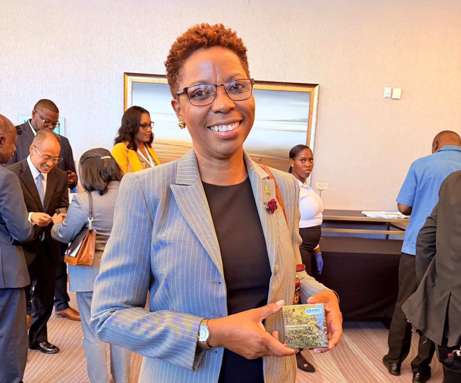 Minister within the Ministry of Housing, Hon. Vanessa Benjamin, Displaying Her EMC Memorabilia